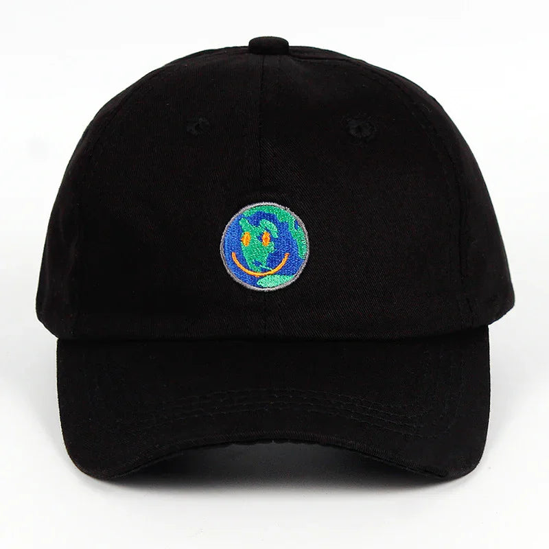 Black baseball cap with embroidered smiling Earth logo in blue, green, and orange