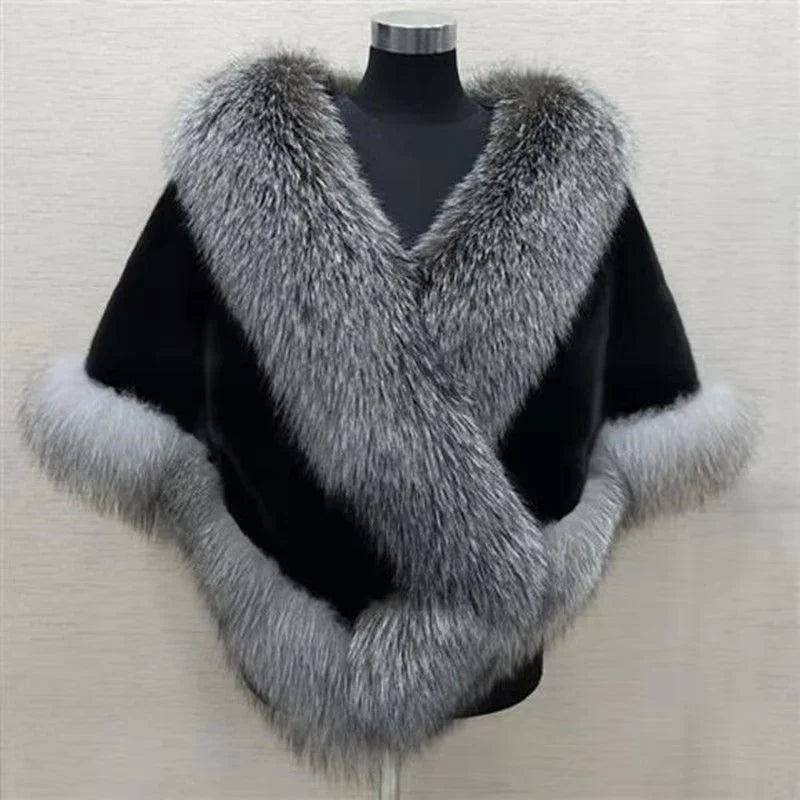 Black shawl with thick gray fur trim displayed on mannequin