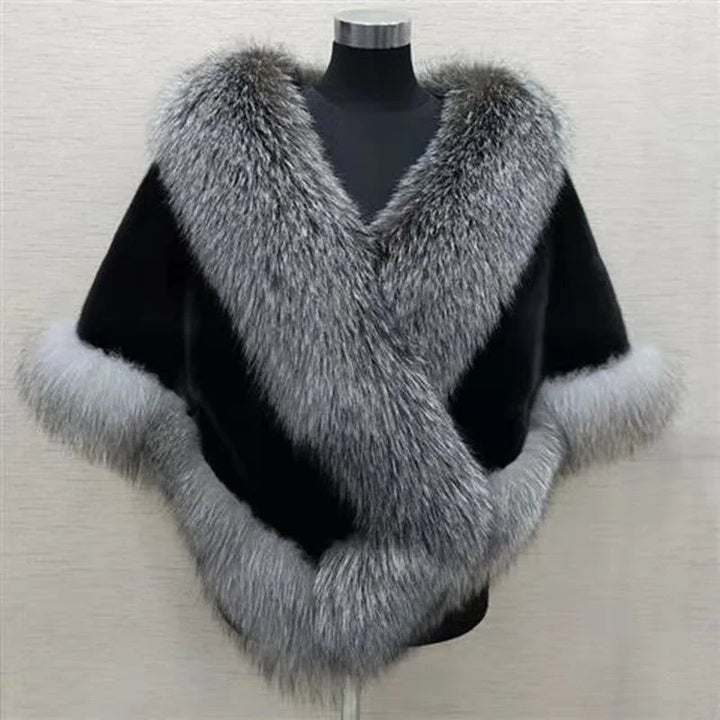 Black shawl with thick gray fur trim displayed on mannequin