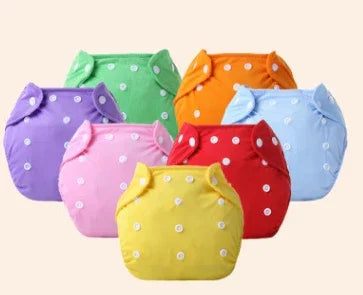 Set of colorful reusable cloth diapers with white snaps in green, orange, light blue, purple, pink, red, and yellow
