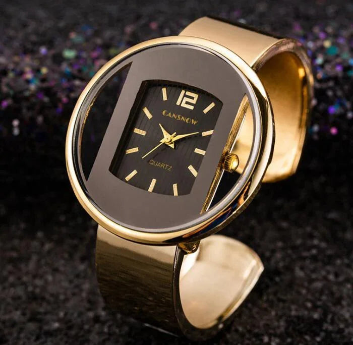 Gold-tone Cansnow quartz wristwatch with black rectangular dial and gold markers on textured black background