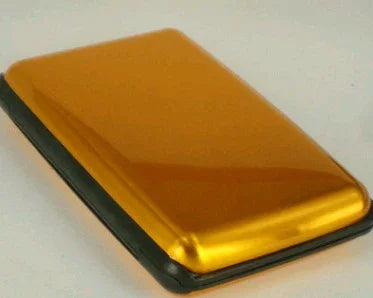 golden metal card holder with black base on white background