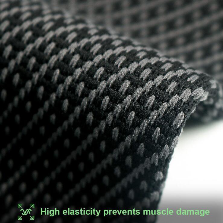 Close-up of high elasticity black and gray textured fabric for muscle support.