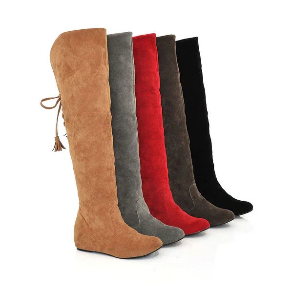 Row of suede knee-high wedge boots in tan, gray, red, brown, and black colors