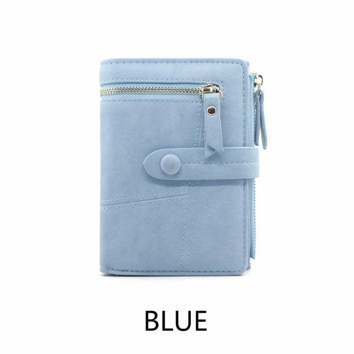 Light blue women's wallet with zippered pockets and snap button closure