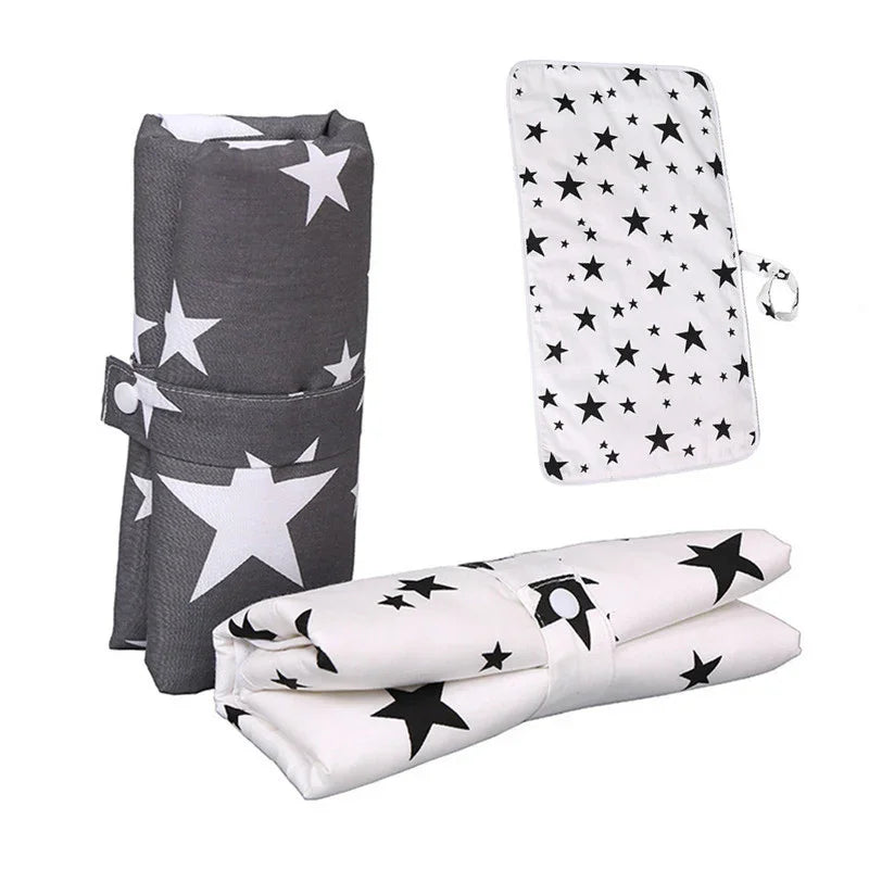 Foldable portable star-patterned changing mats in black and white colors for baby care