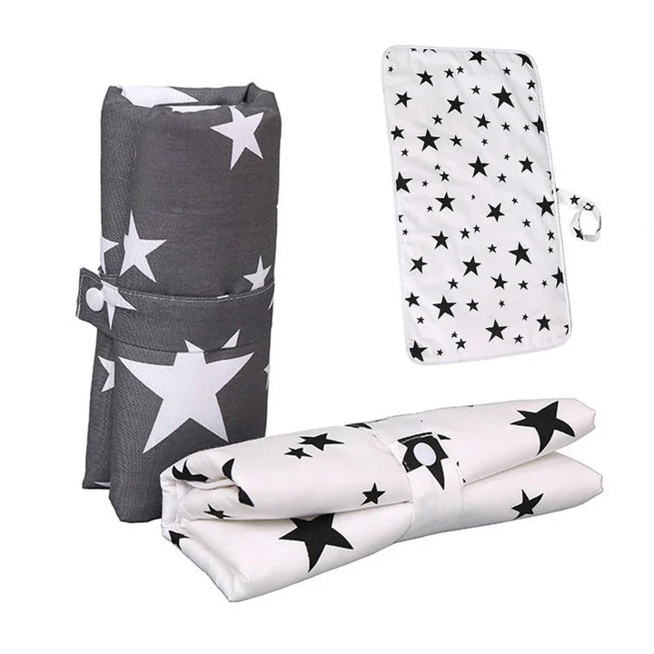 Foldable portable star-patterned changing mats in black and white colors for baby care