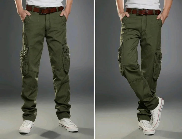 Men's olive green cargo pants with multiple pockets, worn with white sneakers and brown belt