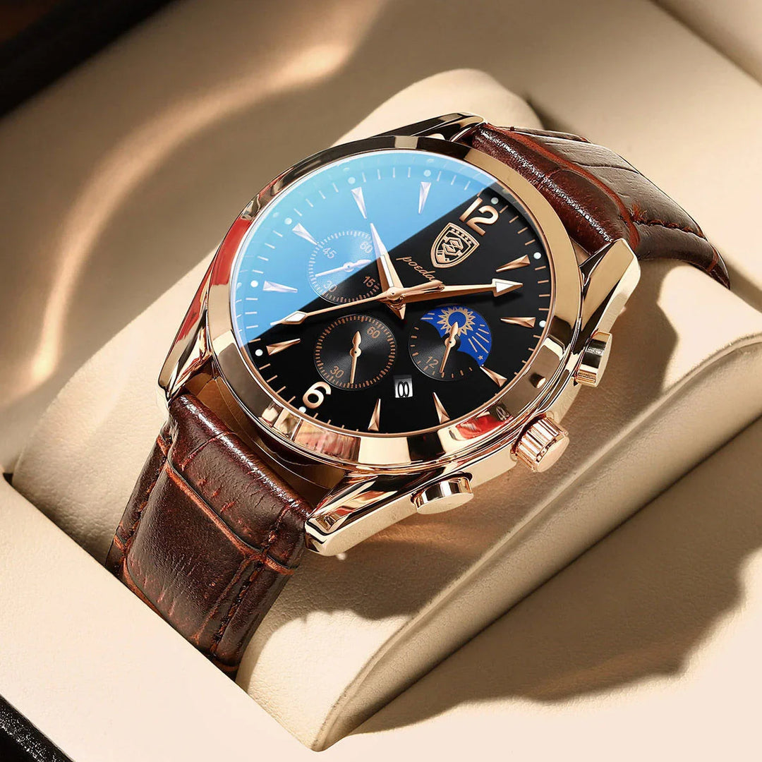 Luxury wristwatch with black dial, gold case, brown leather band, and sunmoon subdial on beige cushion