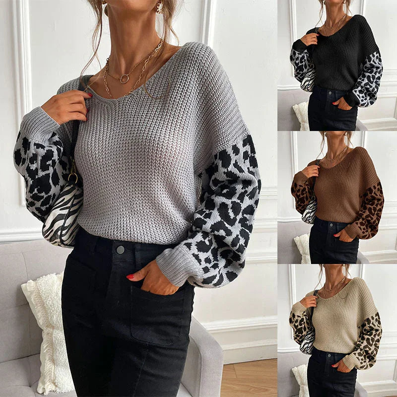 Womens knit sweater with leopard print balloon sleeves in gray, black, brown, and beige colors styled with black pants