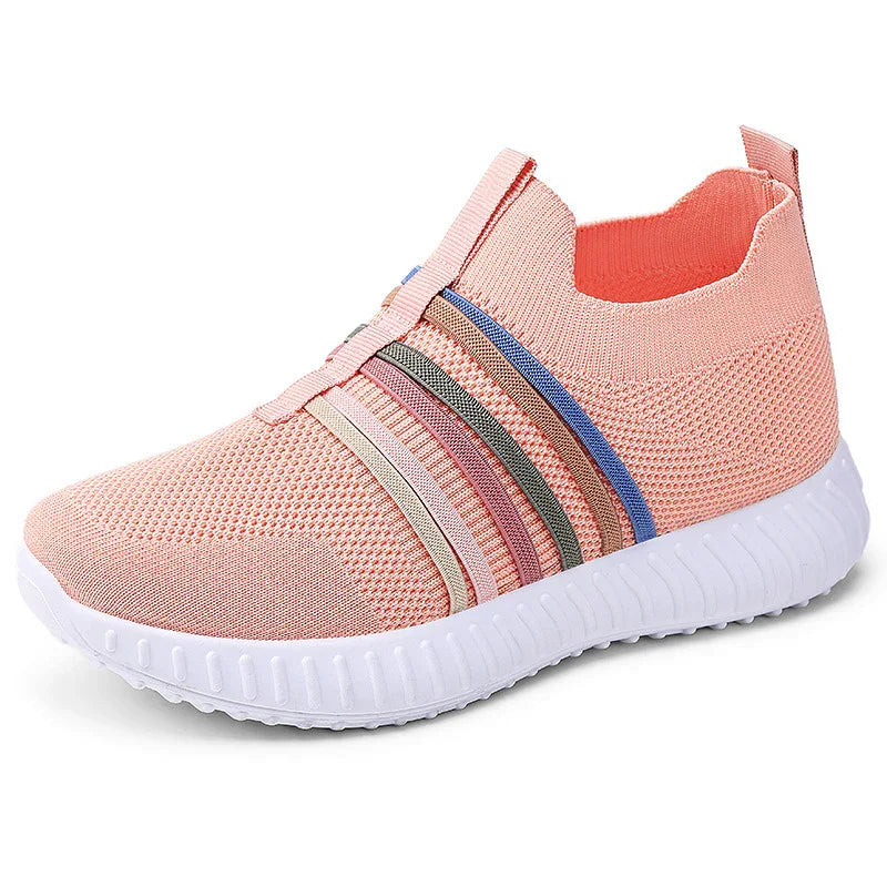 Light pink knit slip-on sneaker with colorful side stripes and white textured sole