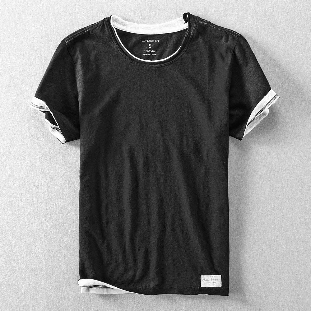 Vintage fit black cotton T-shirt with white crew neck and sleeve accents, size small