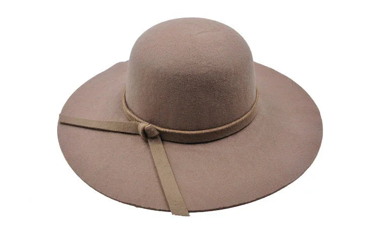 Beige wide-brimmed felt hat with decorative thin band and knot detail
