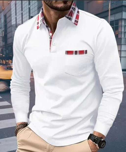 Man wearing white long-sleeve polo shirt with red plaid collar and pocket detail in urban setting