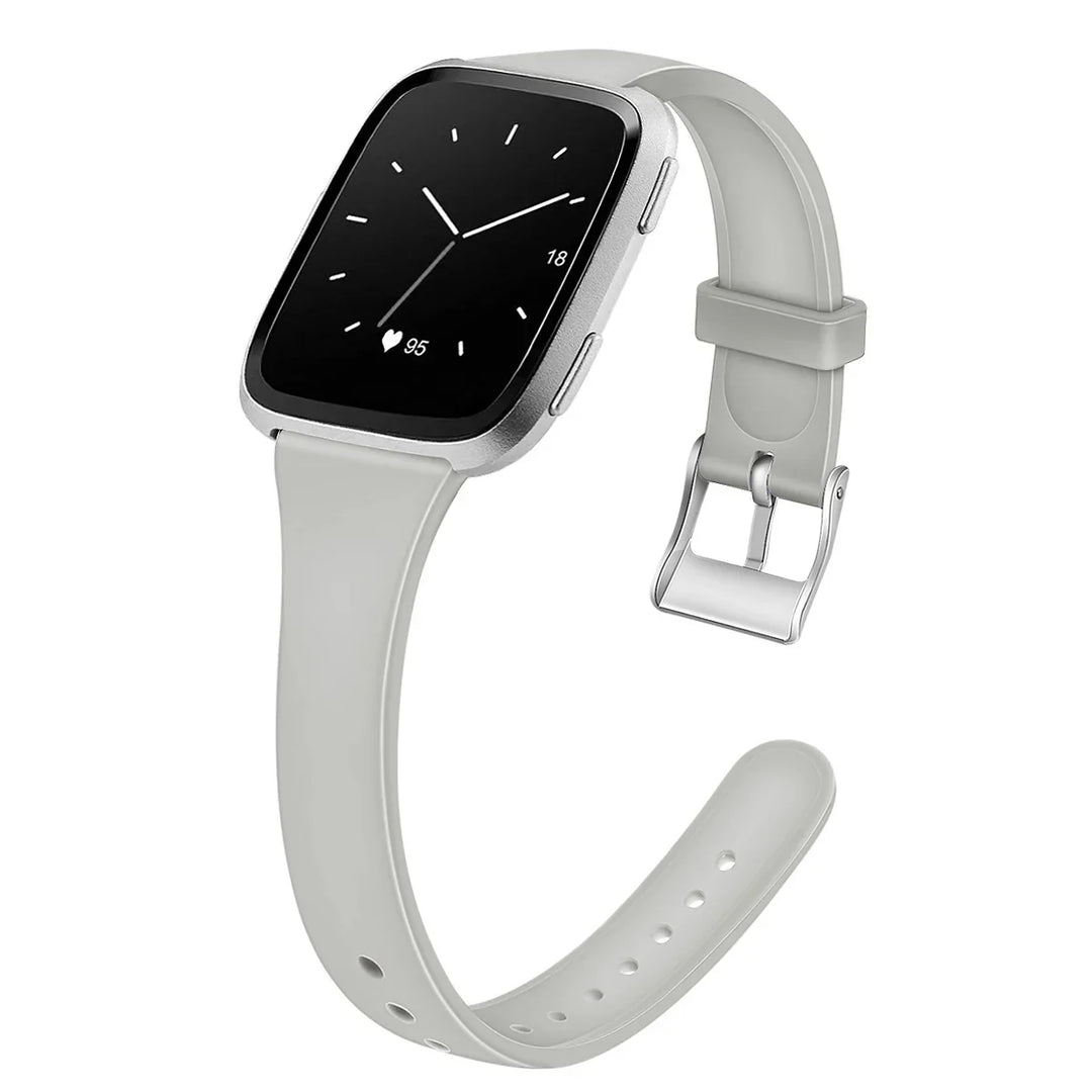Silver smartwatch with light gray silicone strap showing heart rate and analog-style clock face
