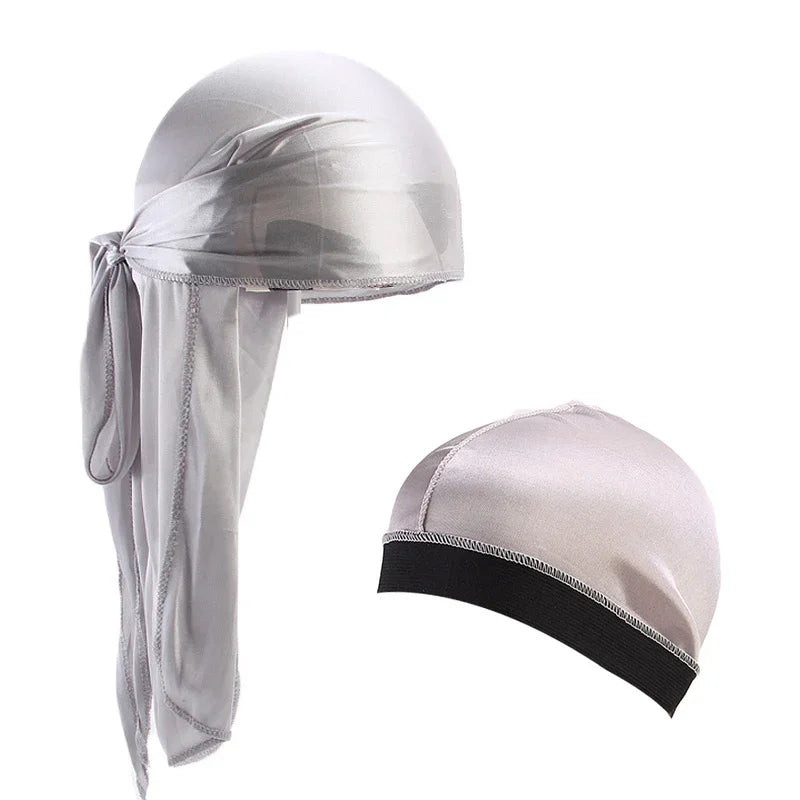 Silver satin durag with tied back and matching silver satin skull cap with black band