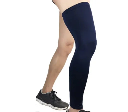 Person wearing a navy blue full leg compression sleeve and black sneaker