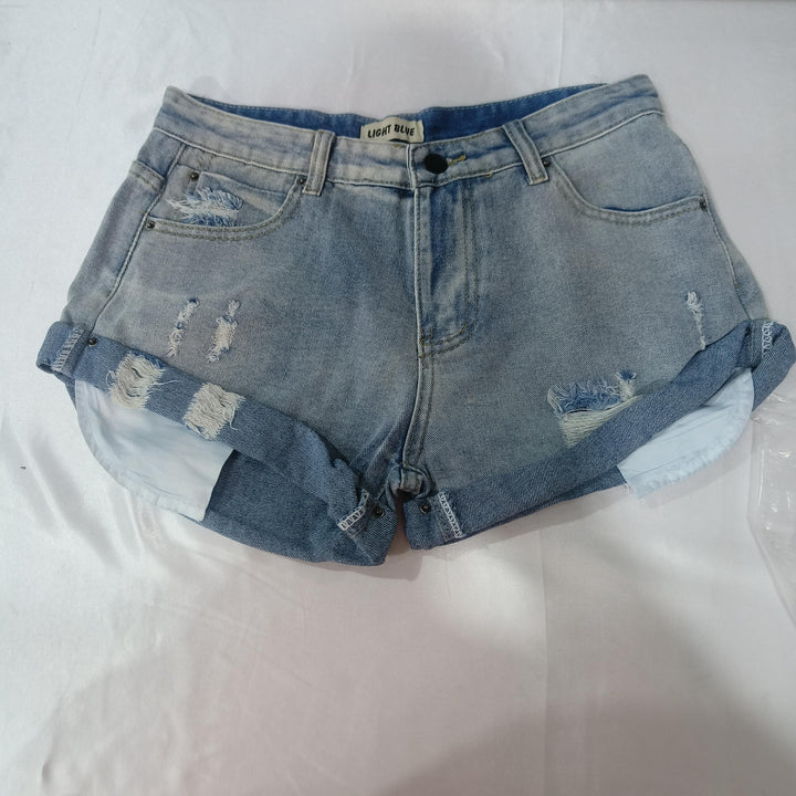 Light blue distressed denim shorts with rolled cuffs and front pockets on white background
