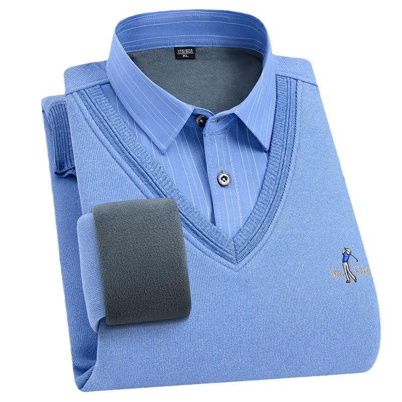 Folded blue V-neck sweater with embedded golf player logo over a blue striped dress shirt