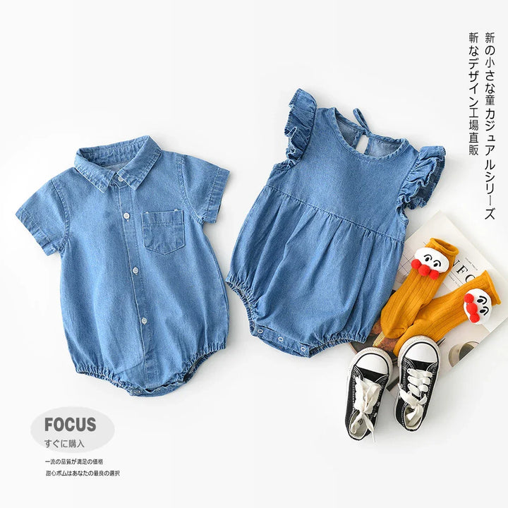 Two blue denim baby onesies, one with short sleeves and collar, the other with ruffled sleeves, paired with yellow character socks and black baby sneakers