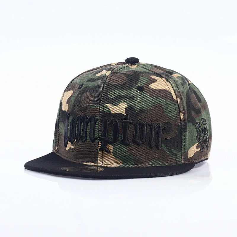 Green and brown camouflage snapback cap with black embroidered text and black brim