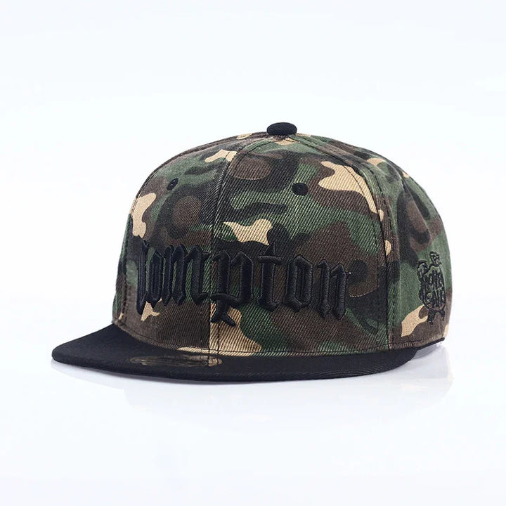 Green and brown camouflage snapback cap with black embroidered text and black brim