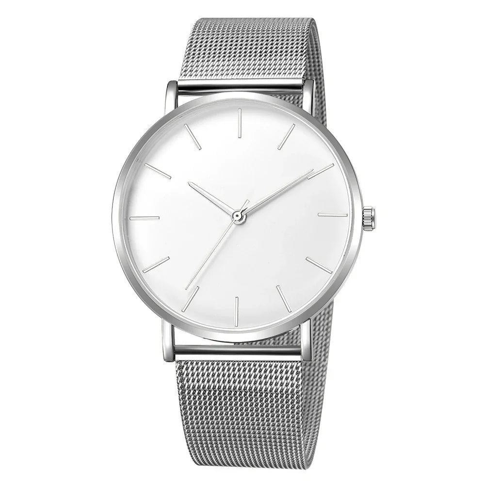 Minimalist silver wristwatch with mesh band and white dial, no numerals