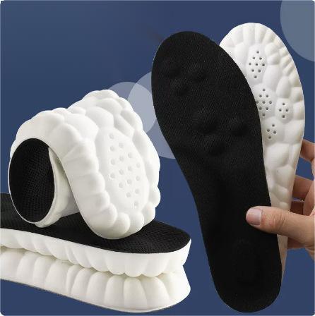 Memory foam shoe insoles with black tops and white cushioned bottoms, ergonomic design