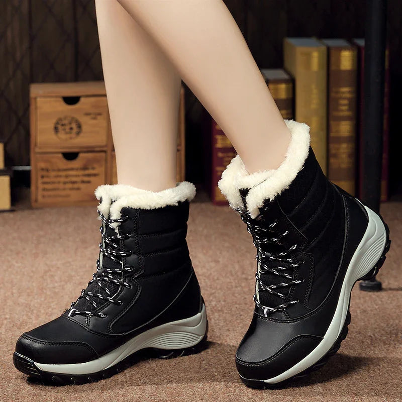 Black winter boots with white fur lining and zipped lace-up design on carpeted floor