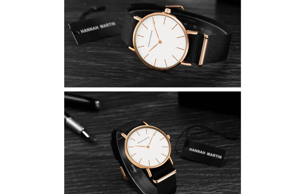 Hannah Martin minimalist wristwatch with white dial, rose gold case, and black fabric strap on dark wood surface