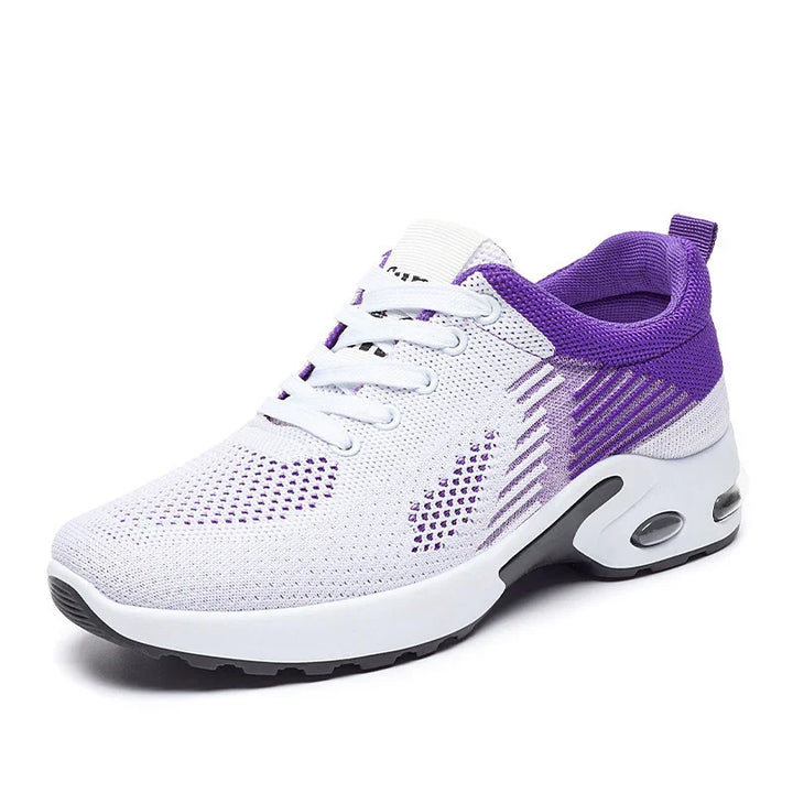 White and purple breathable knit running shoe with lace-up closure and cushioned sole