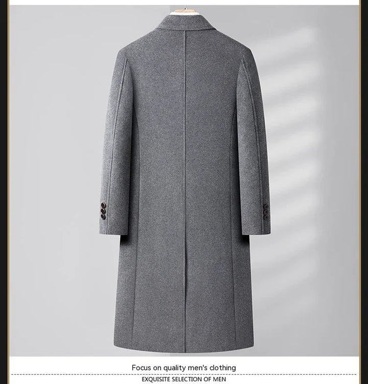 Back view of a gray men's wool overcoat with buttoned sleeves on a wooden hanger