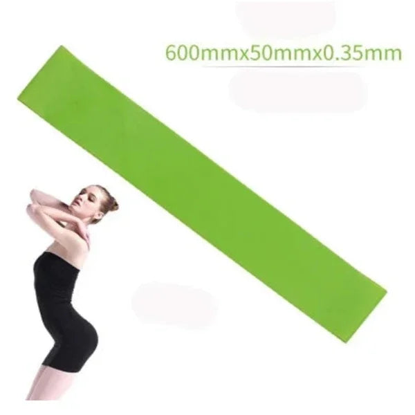 Green resistance band 600mm x 50mm x 0.35mm with woman in black exercise outfit
