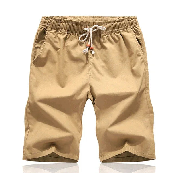 Beige men's casual shorts with elastic waistband and white drawstring on white background
