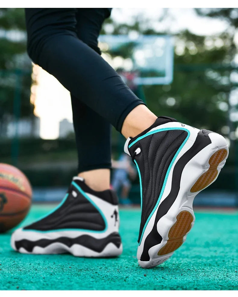 Close-up of black and white basketball shoes with turquoise accents on outdoor court