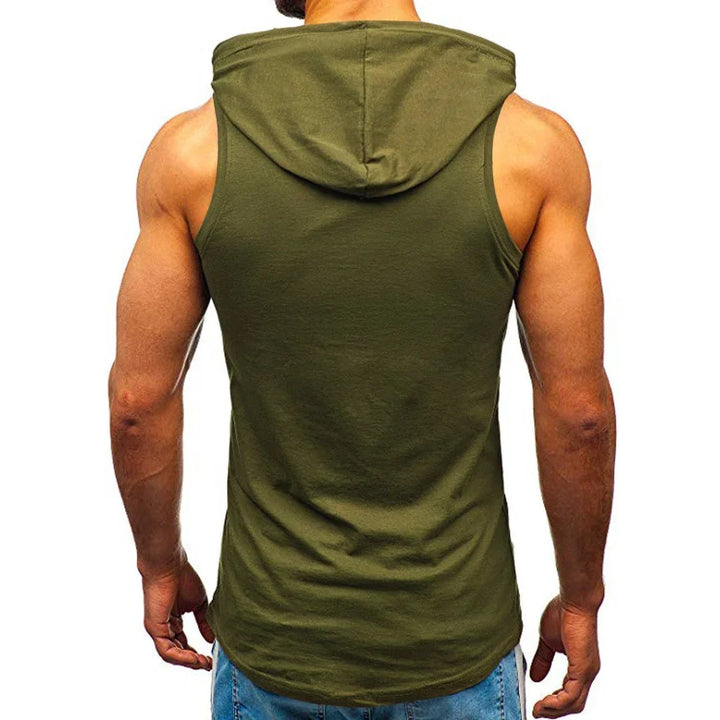 Muscular man wearing sleeveless olive green hooded tank top with blue jeans, back view