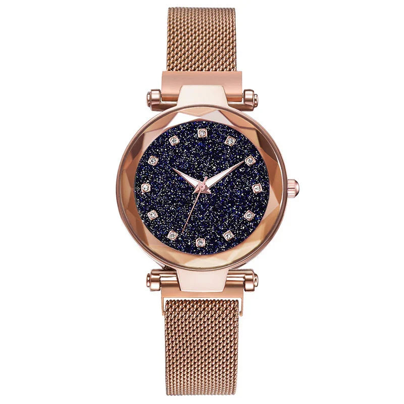Rose gold women's wristwatch with glittery dark blue dial and mesh metal strap