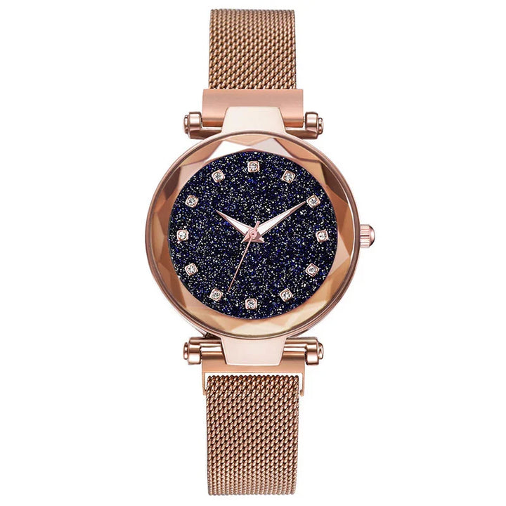 Rose gold women's wristwatch with glittery dark blue dial and mesh metal strap