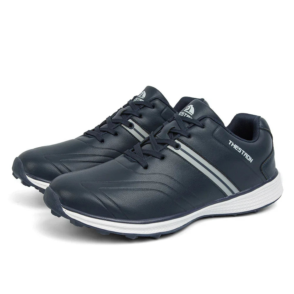 Black sports running shoes with white sole and grey accents, labeled THESTRON