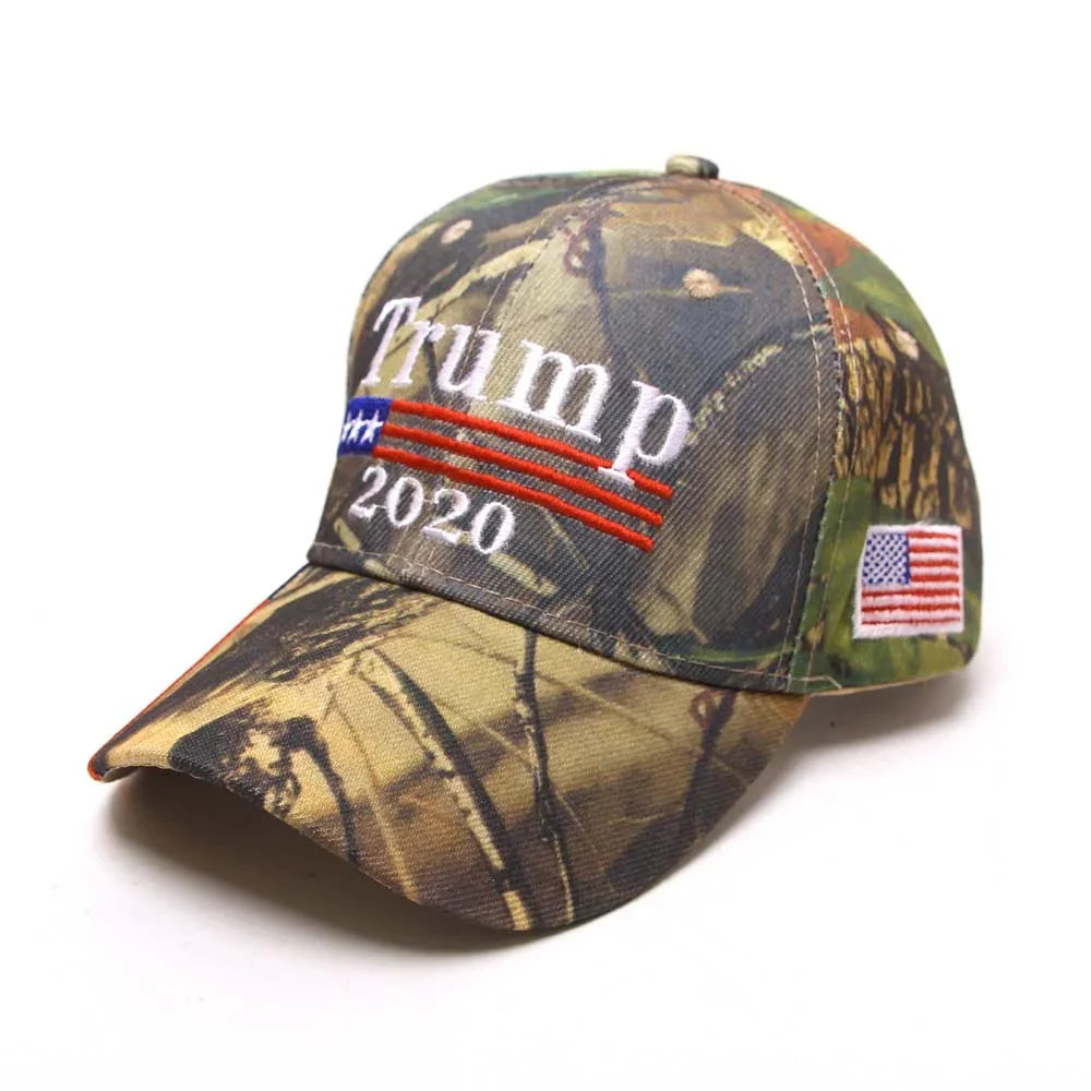 Camo baseball cap with Trump 2020 embroidered text and American flag patch on side