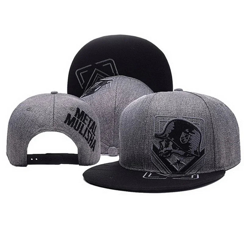 Gray and black Metal Mulisha snapback hats featuring skull logo and embroidered brand name