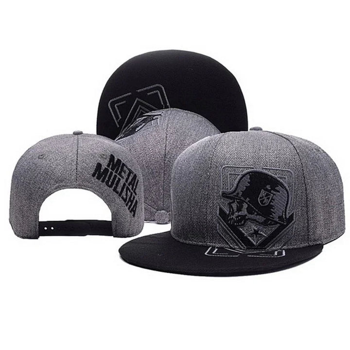 Gray and black Metal Mulisha snapback hats featuring skull logo and embroidered brand name