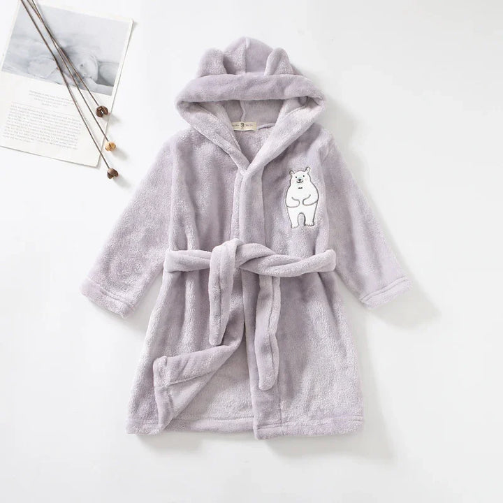 Soft lavender hooded children's bathrobe with bear embroidery and tie belt on white background