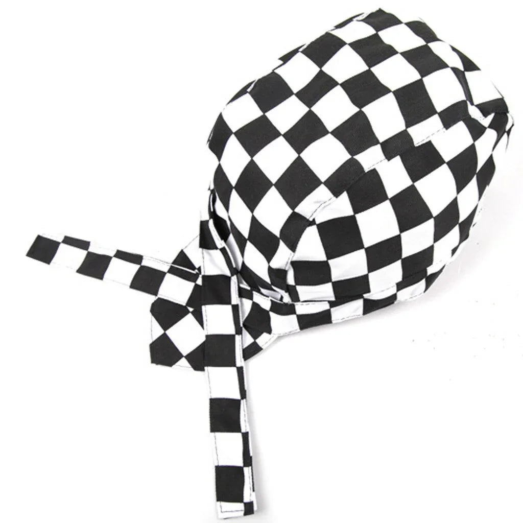 Black and white checkered cycling cap with a tied strap on a white background