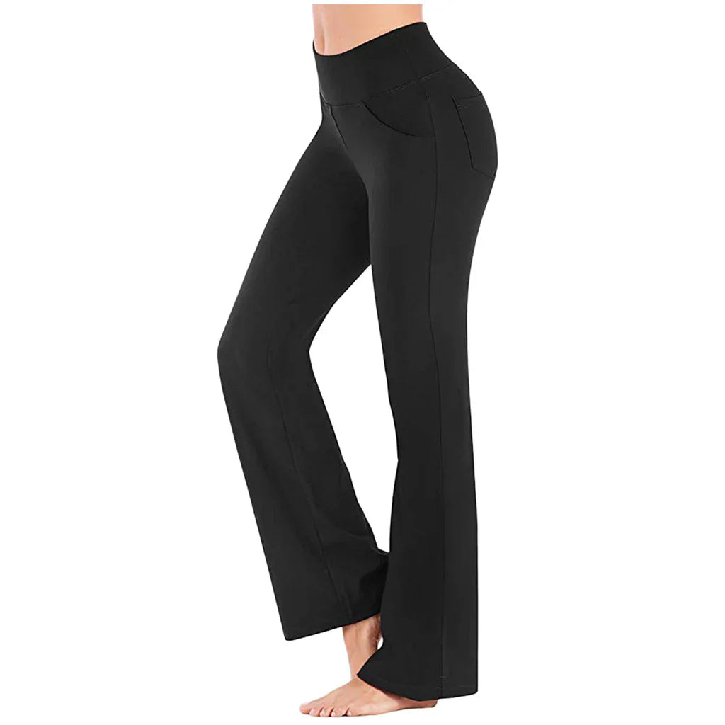 Woman wearing black high-waisted bootcut yoga pants with side and back pockets