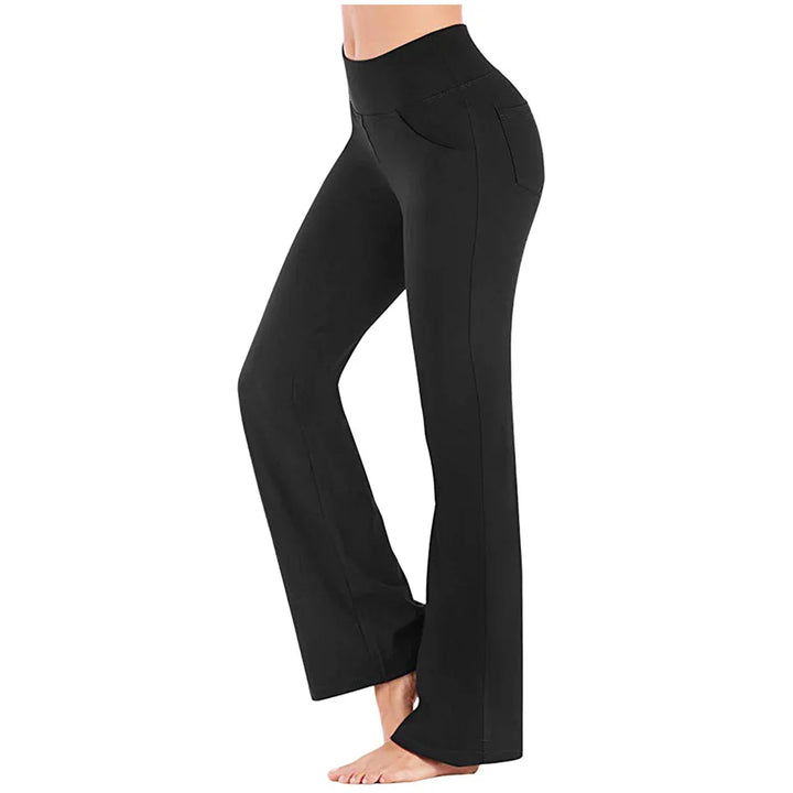 Woman wearing black high-waisted bootcut yoga pants with side and back pockets