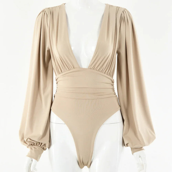 beige long sleeve bodysuit with puffed sleeves and deep V neckline on mannequin