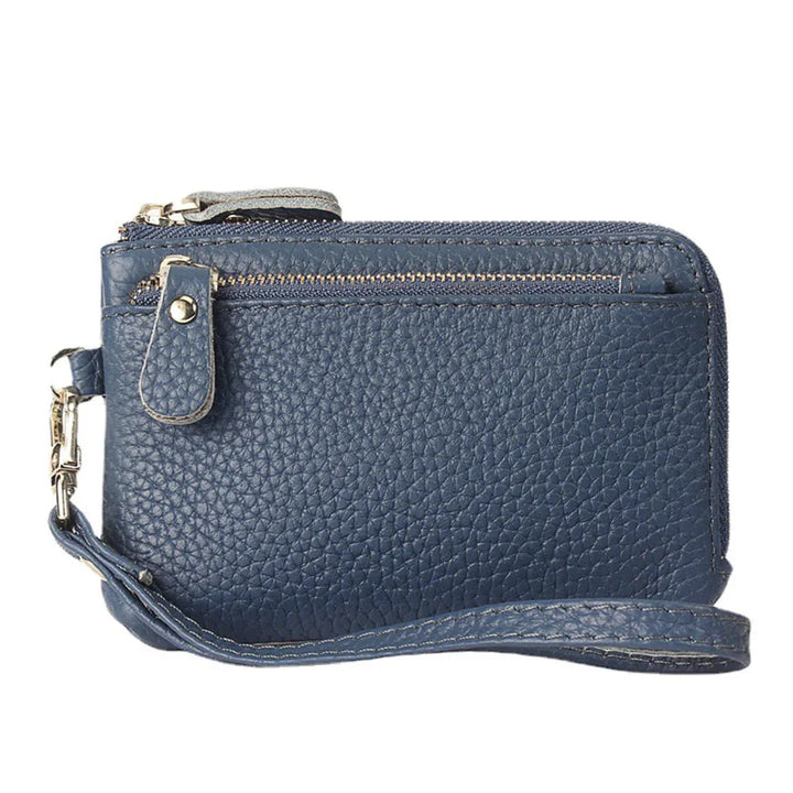 blue textured leather wristlet wallet with zippered compartments and wrist strap