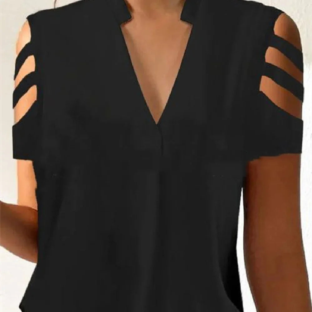 Black women's top with cold shoulder cutouts and triple strap detail on sleeves