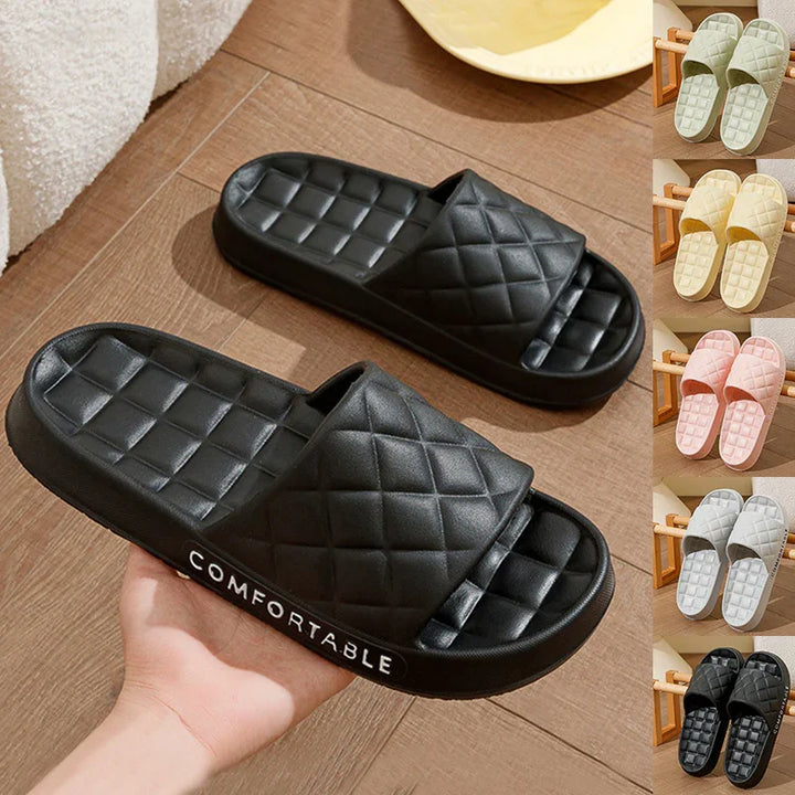Black quilted cushioned slide sandals with open toe, comfortable sole, shown with color options